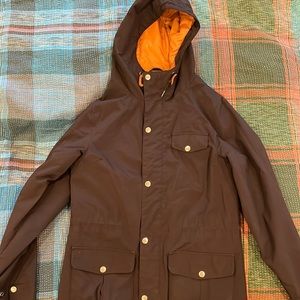 Poler zip and snap women’s insulated rain jacket, black with brown inside, small